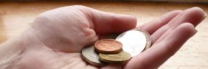 180 best coin collecting terms explained - holding irish coins in hand - Ireland Coins